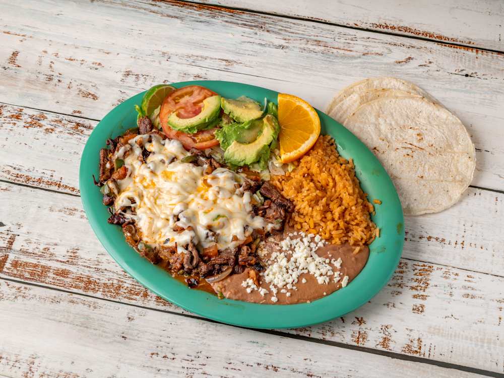 El Famoso — chopped ribeye grilled with peppers and onions, smothered in melted cheese